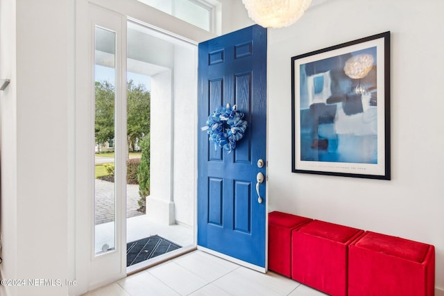 foyer entrance with light tile patterned floors