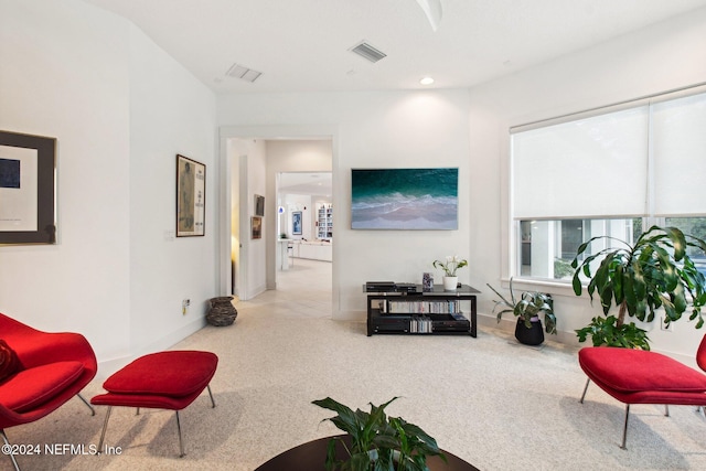 living room with light colored carpet