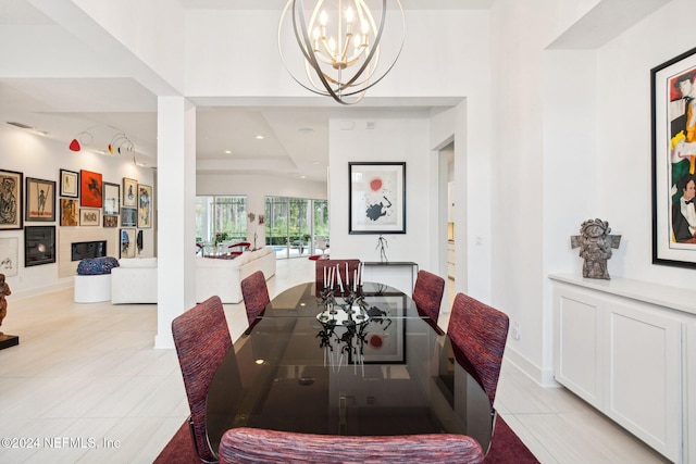 tiled dining space with an inviting chandelier