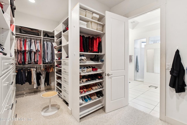 spacious closet featuring light tile patterned floors