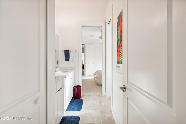 bathroom featuring ceiling fan, vanity, and tile patterned flooring