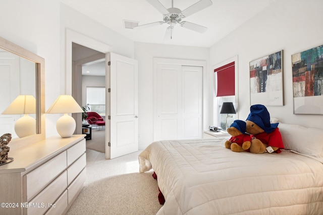 bedroom with light carpet and ceiling fan