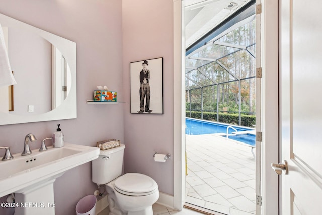 bathroom with toilet and tile patterned flooring