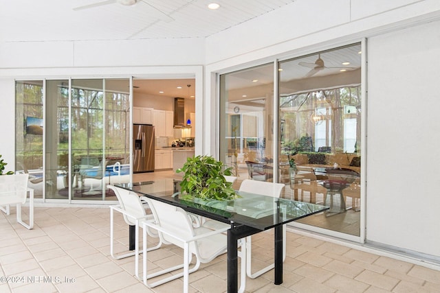 sunroom / solarium with plenty of natural light and ceiling fan