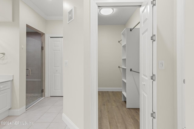 interior space with light tile patterned flooring and visible vents