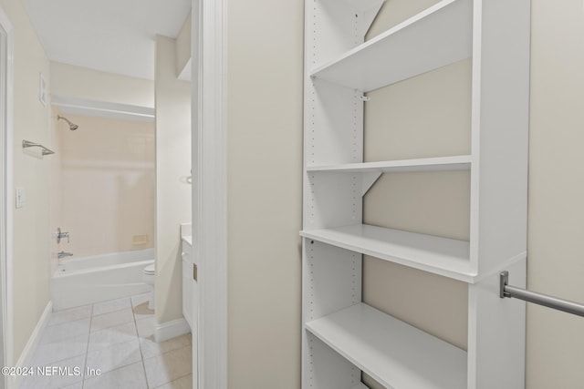 spacious closet with light tile patterned flooring