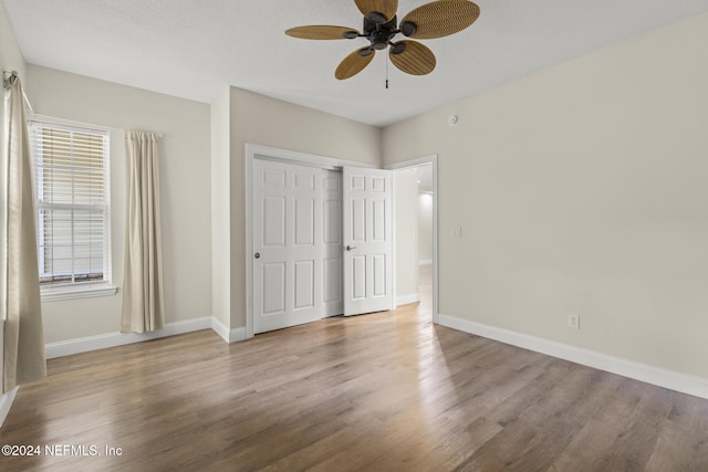 135 N Champions Way Unit 212, Saint Augustine, FL 32092 - unfurnished bedroom featuring wood finished floors, a closet, and ceiling fan
