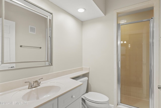 bathroom with visible vents, a shower stall, toilet, and vanity