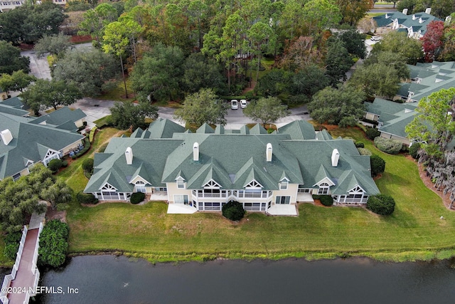 drone / aerial view featuring a residential view and a water view