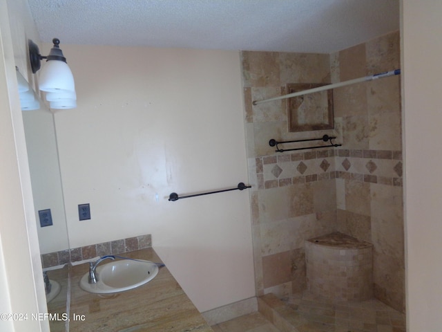 bathroom featuring vanity and a textured ceiling