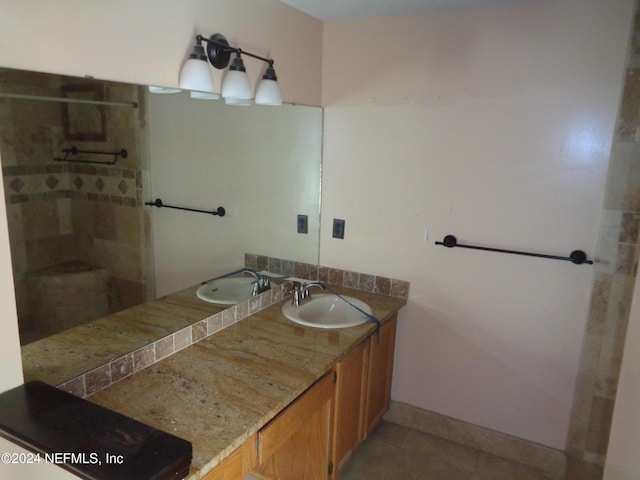 bathroom featuring tile patterned flooring and vanity