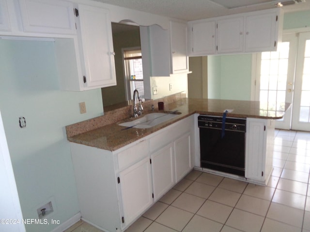 kitchen featuring kitchen peninsula, sink, dishwasher, white cabinetry, and light tile patterned flooring