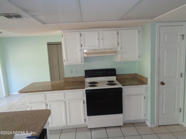 kitchen featuring white range with electric stovetop, white cabinetry, and light tile patterned floors