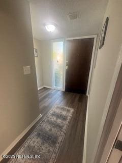 hall with dark hardwood / wood-style flooring