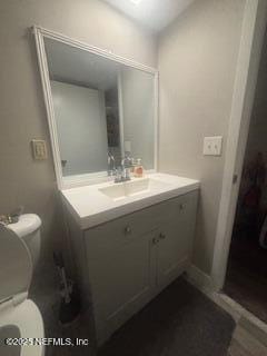 bathroom with vanity and toilet