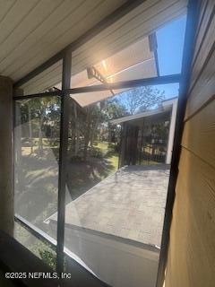 doorway featuring vaulted ceiling