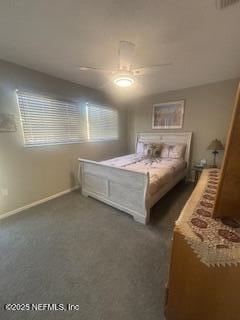 unfurnished bedroom featuring dark carpet and ceiling fan