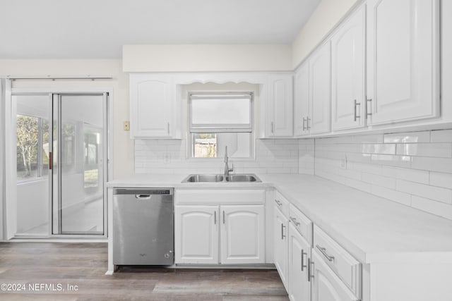 kitchen featuring dishwasher, white cabinets, a wealth of natural light, and sink