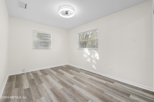 spare room with light hardwood / wood-style flooring