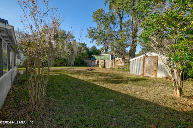 view of yard with a storage shed