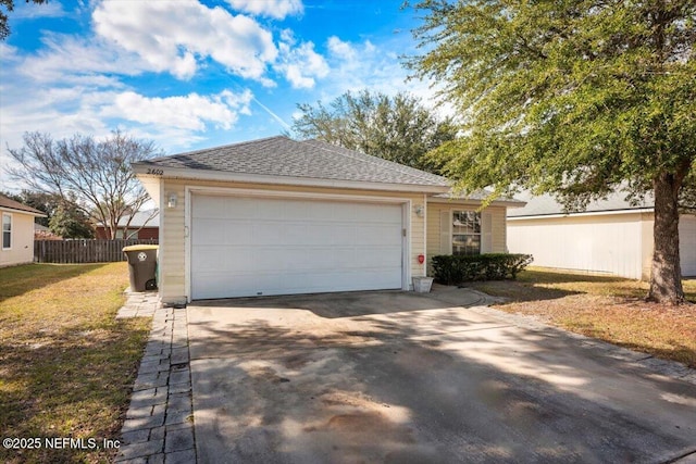 view of front of home featuring a garage, an outdoor structure, and a front yard