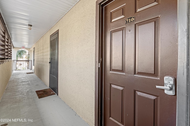 doorway to property featuring a porch