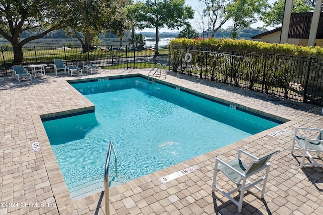 view of swimming pool with a patio