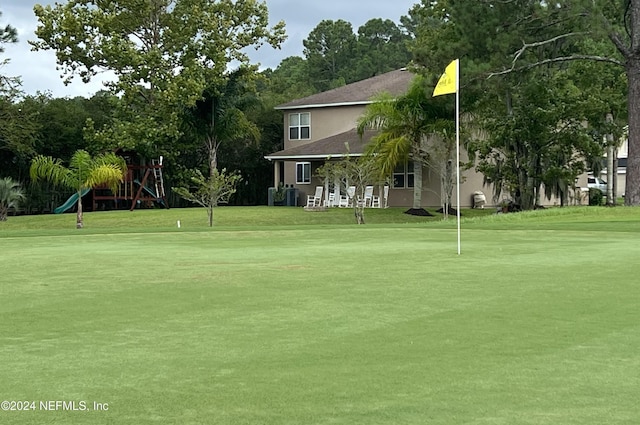 view of home's community featuring a lawn