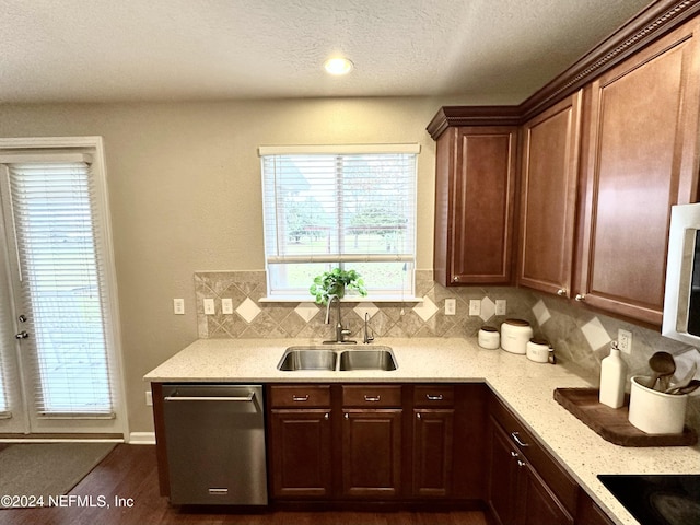 kitchen with backsplash, black electric cooktop, dark wood-type flooring, sink, and dishwasher