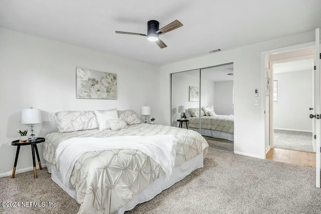 carpeted bedroom featuring a closet and ceiling fan