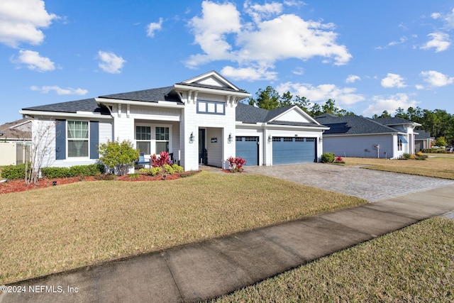 view of front facade with a garage and a front yard