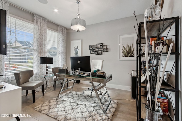 office area with light hardwood / wood-style flooring