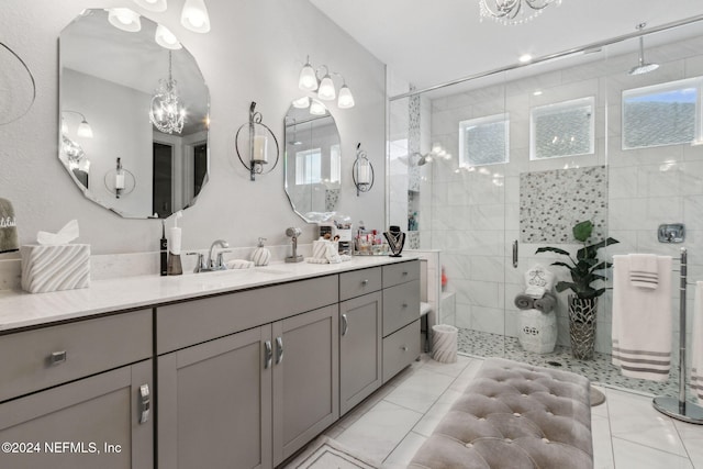 bathroom featuring vanity and tiled shower