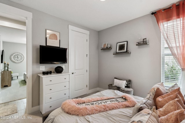 bedroom with multiple windows