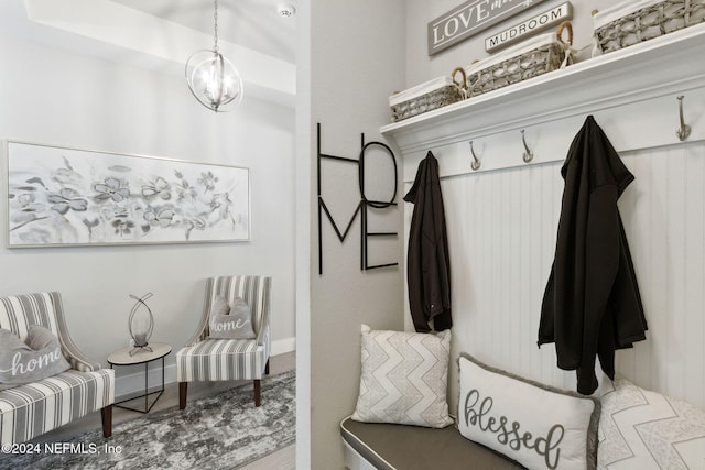 mudroom with a chandelier