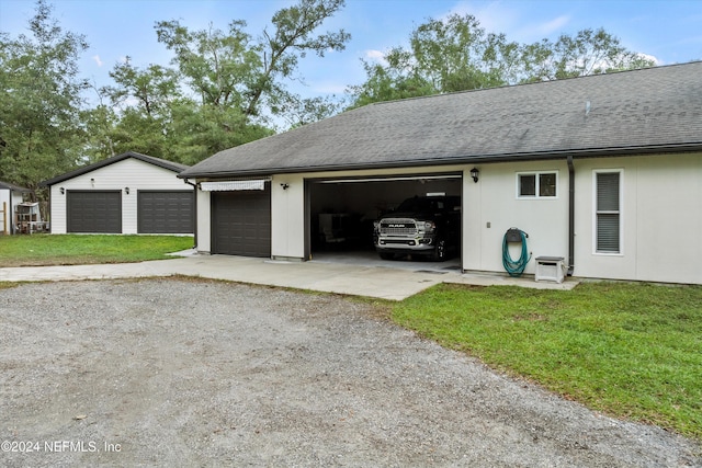 garage featuring a yard