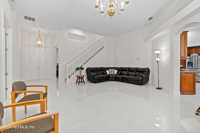 living room featuring a notable chandelier