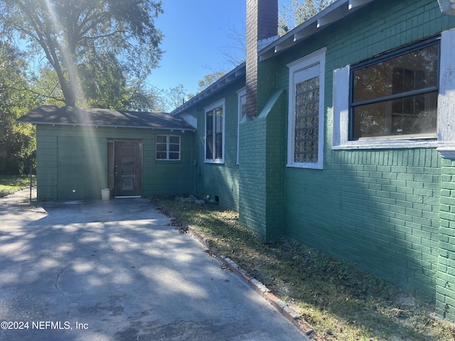 view of side of property with a patio area