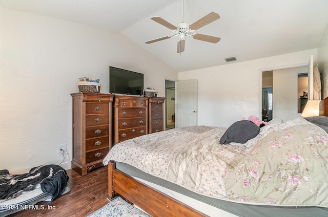 bedroom featuring ceiling fan, dark hardwood / wood-style floors, and lofted ceiling