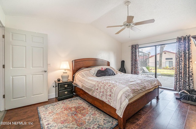 bedroom with access to exterior, ceiling fan, dark hardwood / wood-style flooring, and vaulted ceiling