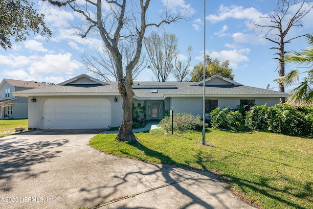 view of front of property with stucco siding, driveway, roof with shingles, a front yard, and an attached garage