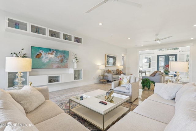 living room featuring french doors and ceiling fan