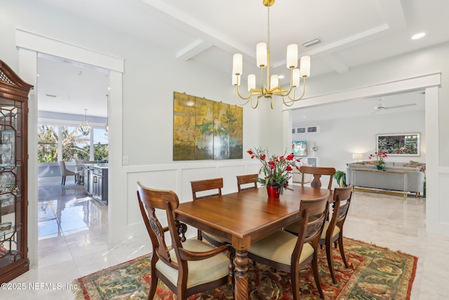 dining area featuring a notable chandelier and beamed ceiling