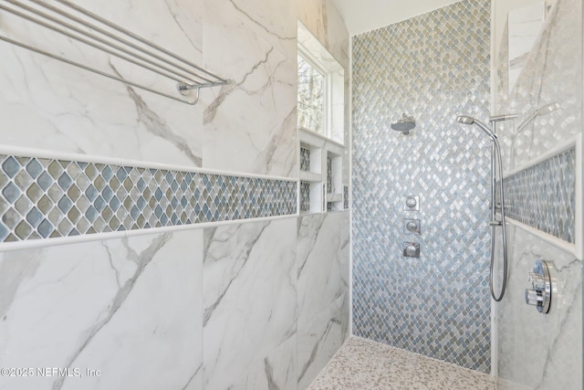 bathroom featuring a tile shower