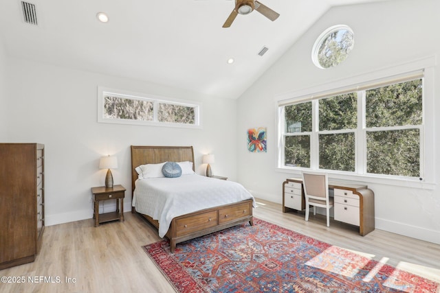 bedroom with vaulted ceiling, ceiling fan, and light hardwood / wood-style floors