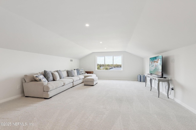 living room with light colored carpet and vaulted ceiling