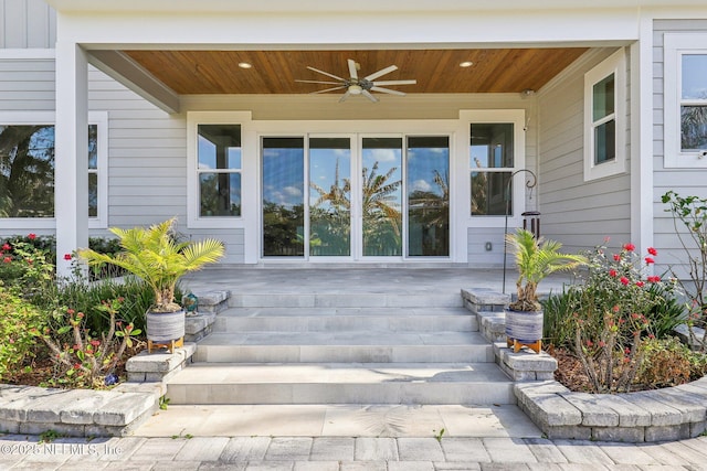 property entrance with ceiling fan