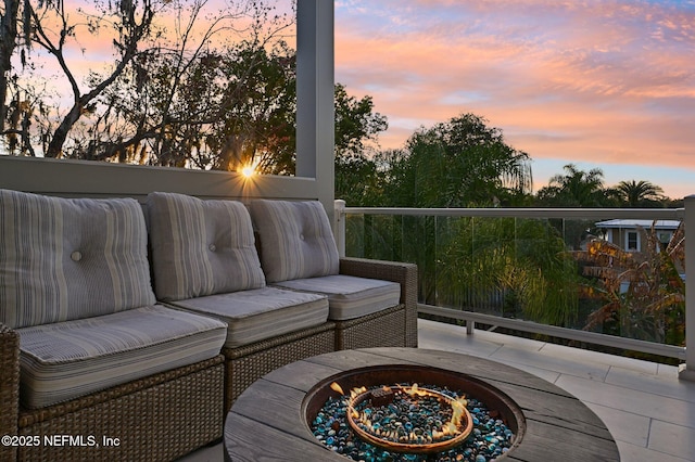 exterior space with a patio and an outdoor fire pit