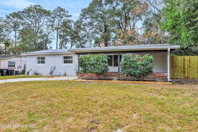 ranch-style house with a front yard