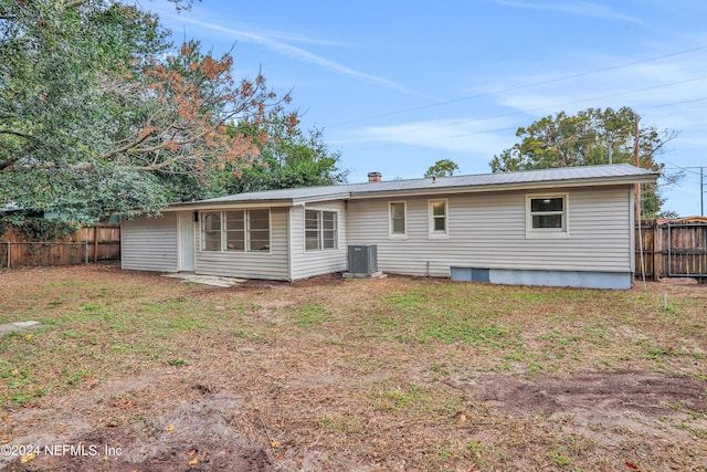 rear view of house with central air condition unit